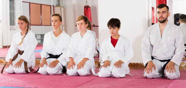istock Kids taekwondo group ready to practice 1166161163