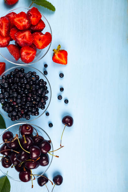 istock Ripe berries in transparent bowls 1166161346
