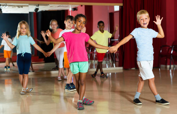 istock Joyful children trying dancing partner dance 1166161373