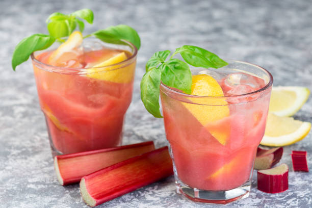 istock Refreshing lemonade with rhubarb, lemon, sparkling water and basil in  glass, horizontal 1166162080