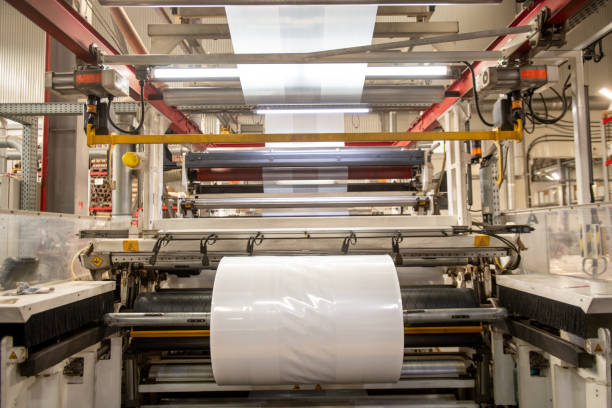 istock Huge industrial machine with rolled newly produced transparent polyethylene film 1166164627