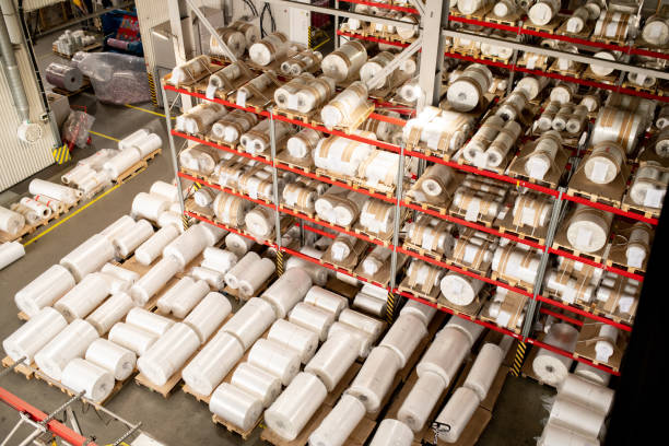 istock Many rolled polyethylene film units on shelves and racks inside warehouse 1166164727