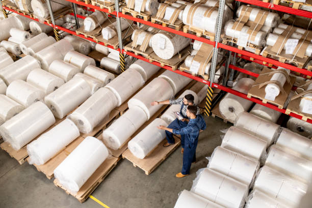 istock Two workers taking decision about which part of new production can be sold 1166164741