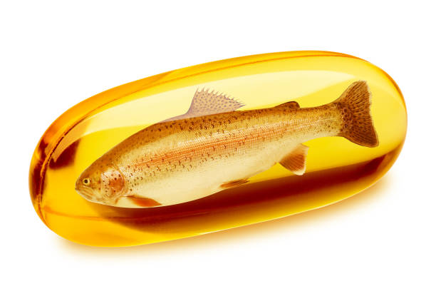 comprimido do óleo de peixes, omega 3, isolado no fundo branco, trajeto de grampeamento, profundidade de campo cheia - fish oil healthy eating capsule isolated - fotografias e filmes do acervo