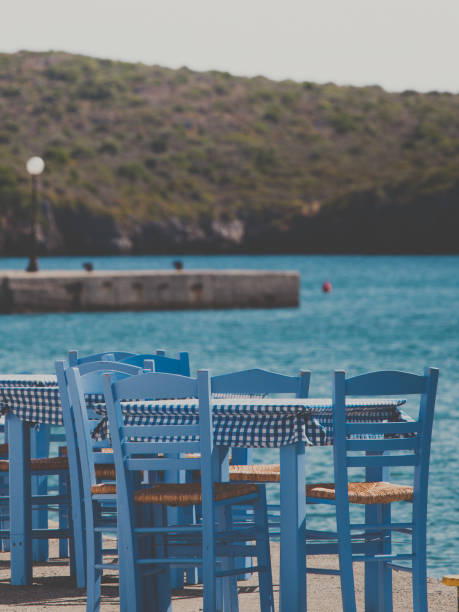 istock Open cafe outdoor restaurant in Greece on sea shore 1166171473