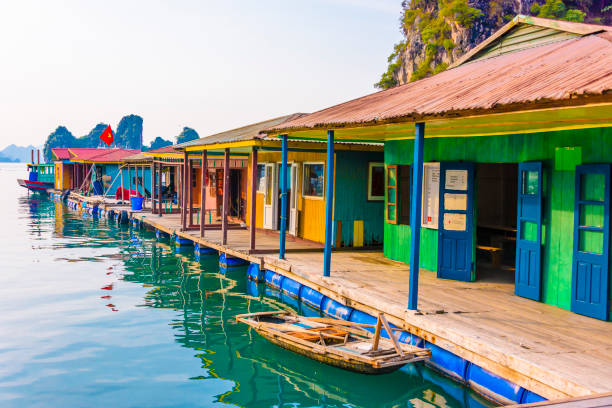 Floating houses at the Cua Van floating village, Halong Bay, Vietnam Floating houses at the Cua Van floating village, Halong Bay, Vietnam gulf of tonkin photos stock pictures, royalty-free photos & images