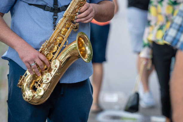 istock The street musician playing saxophone. 1166173953