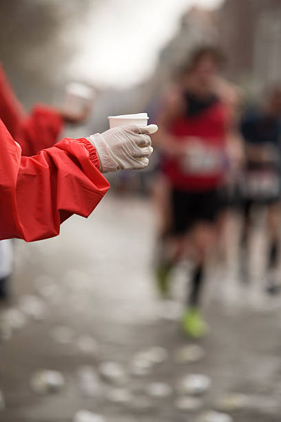 istock running athletes grabbing for a drink 116617428