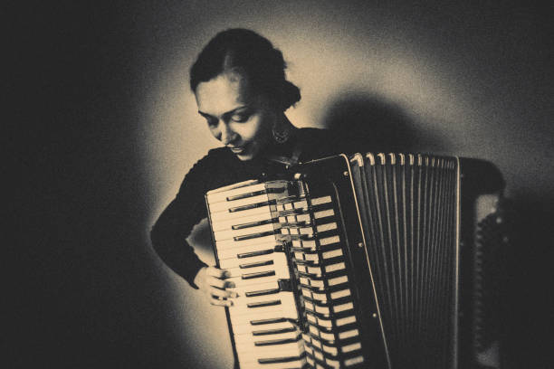 Young Woman with old Accordion Young Woman with old Accordion accordion instrument stock pictures, royalty-free photos & images