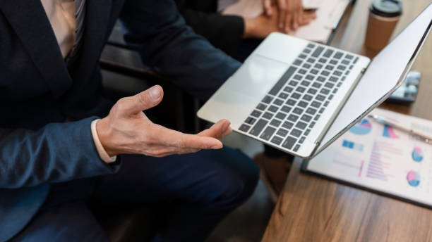 istock Midsection Of Businessman Using Laptop In Office 1166175851