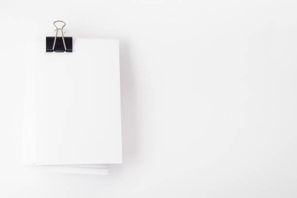 istock Stack of blank white business cards or flyers. Space for text on the right side 1166177846