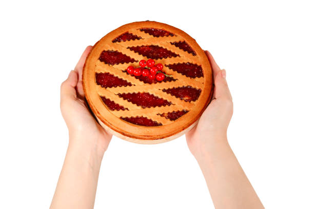 istock Strawberry pie in woman hands isolated on white background 1166182251