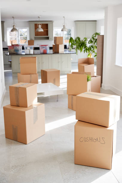 istock Stacked Removal Boxes In Empty Room On Moving Day 1166183038
