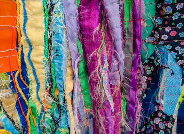 istock Colourful textured fabric strips sewn together. Textile art background. 1166183083
