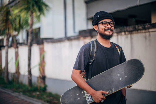 istock Man with skateboard outdoors 1166183165