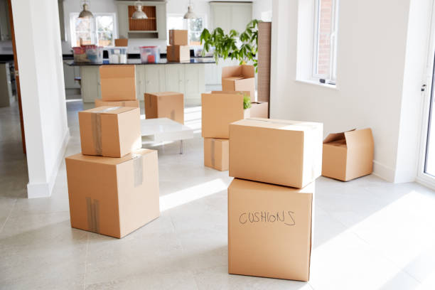 istock Stacked Removal Boxes In Empty Room On Moving Day 1166183357