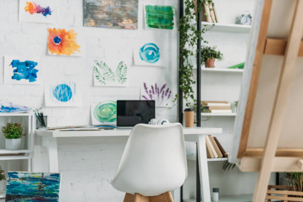 istock selective focus of spacious room with paintings on wall and rack with plants 1166184221