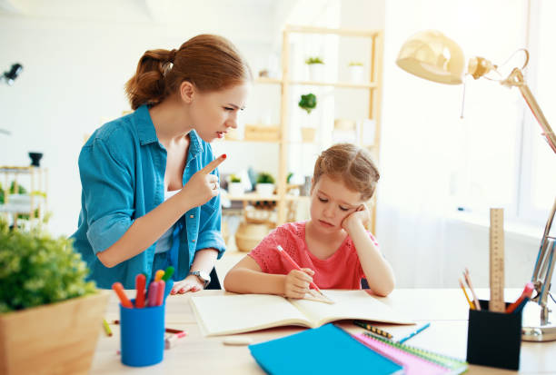 istock mother scolds a child for poor schooling  and homework 1166186702