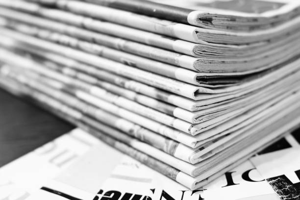 istock Newspaper Pages with Headlines and Articles 1166187840