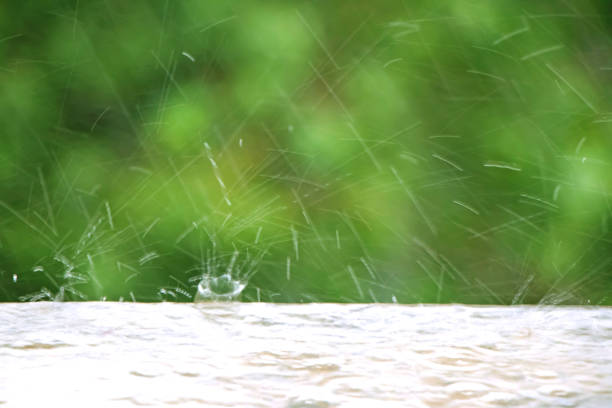 water drops strike in a ground during rainy day