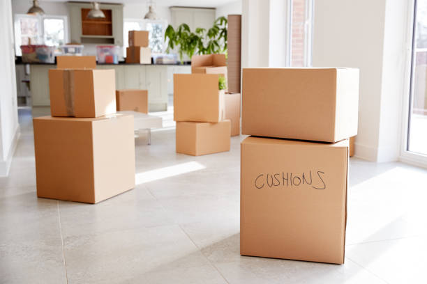istock Stacked Removal Boxes In Empty Room On Moving Day 1166193560