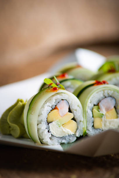 istock mango shrimp roll in cucumber on rock background 1166194305