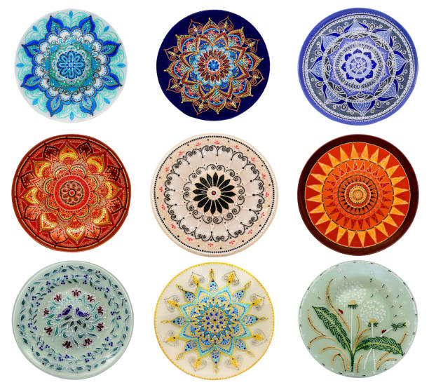 istock Set of decorative ceramic dishes hand-painted with acrylic paints floral pattern isolated on white background 1166194647