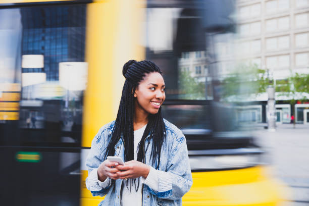 istock Young woman waiting for tram in Alexanderplatz - Berlin 1166196644