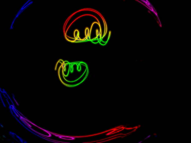 istock colorful light trail signature isolated on the black background 1166199084
