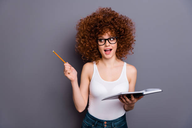 istock Close up photo of beautiful lady reader indicating cool offer empty space wear specs white tank-top isolated grey background 1166199959