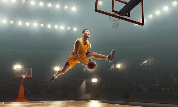 istock Basketball player making a basket. Jump shot. Slam Dunk 1166200190