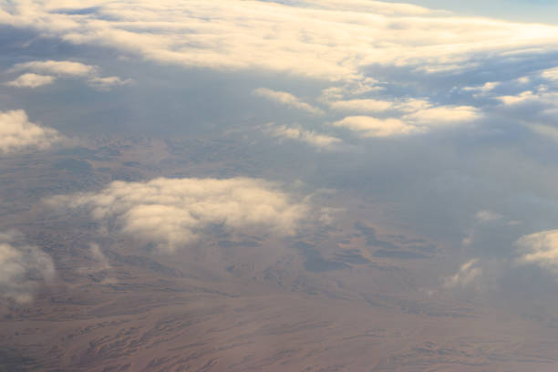 istock Beautiful white clouds in blue sky. View from airplane 1166200495