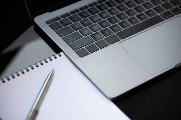 istock Office desk table with modern laptop notepad and pen. 1166202420