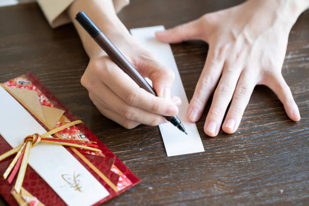 istock Young woman hand writing congratulation bag 1166202508