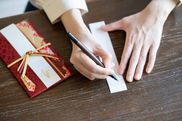 istock Young woman hand writing congratulation bag 1166202517