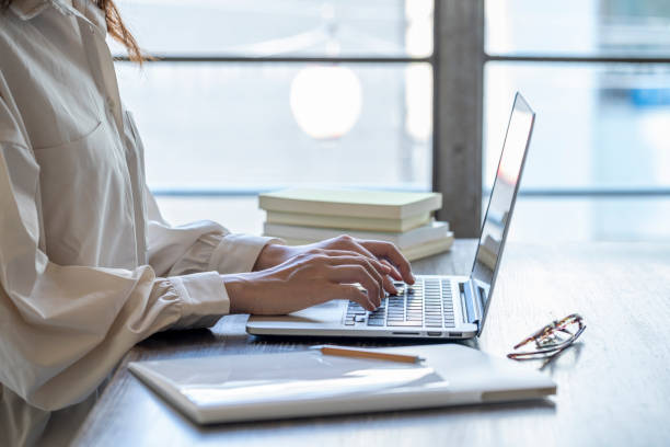 istock The hand of a young woman working at remote work 1166202530