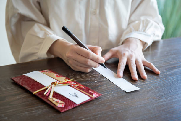 istock Young woman hand writing congratulation bag 1166202876