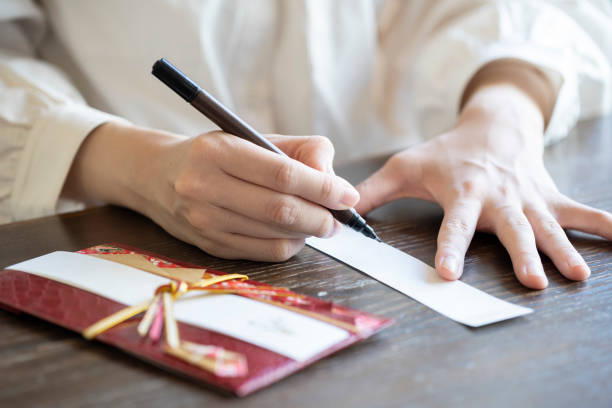 Young woman hand writing congratulation bag