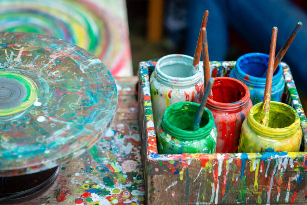 istock Containers with different colors the artist's outdoor workshop. 1166205138