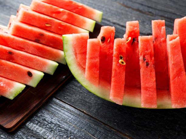 istock Sliced delicious ripe watermelon on the table close-up 1166205622