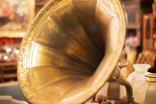 istock retro old gramophone, ancient record player with a yellow pipe close up 1166207124