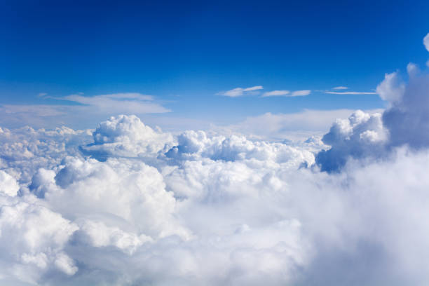 istock White cumulus clouds on clear blue sky background closeup, overcast skies backdrop, fluffy cloud texture, beautiful sunny cloudscape heaven, ozone layer illustration, scenic cloudy weather, copy space 1166207708