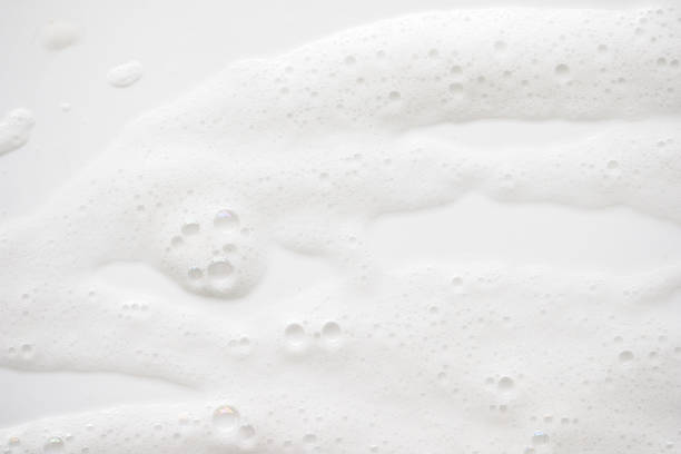 istock Abstract background white soapy foam texture. Shampoo foam with bubbles 1166207800