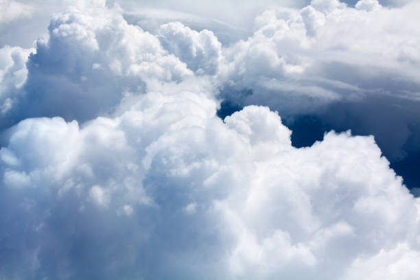 istock White cumulus clouds on blue sky background close up, overcast skies backdrop, fluffy cloud texture, beautiful sunny cloudscape heaven view, ozone layer illustration, scenic cloudy weather, copy space 1166207806