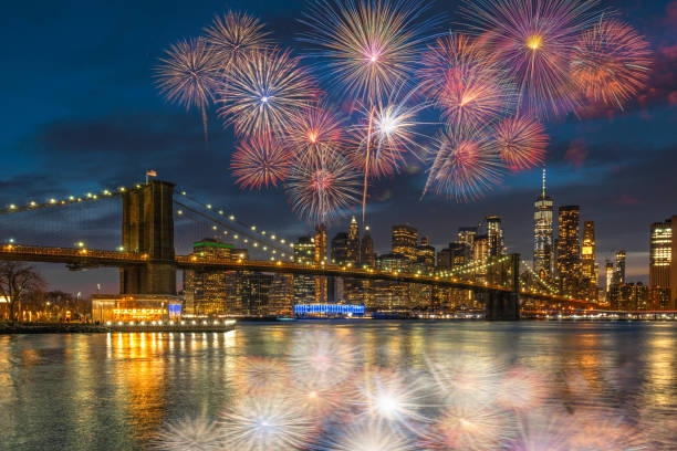 istock Multicolor Firework Celebration over scene of New york Cityscape with Brooklyn Bridge over the east river at the twilight time, USA downtown skyline, 4th of July and Independence day concept 1166207841