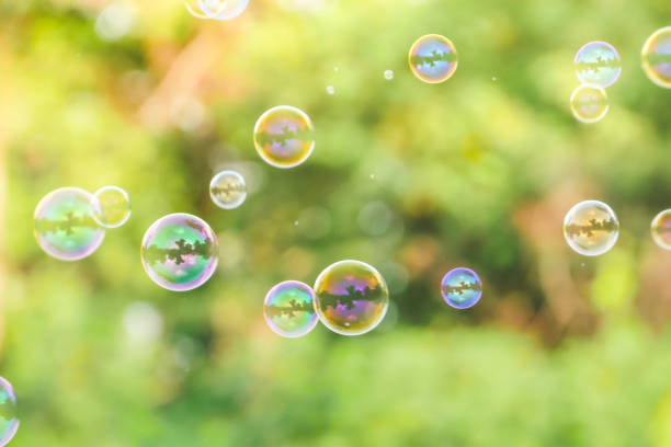 istock soap bubbles on green nature background 1166207870