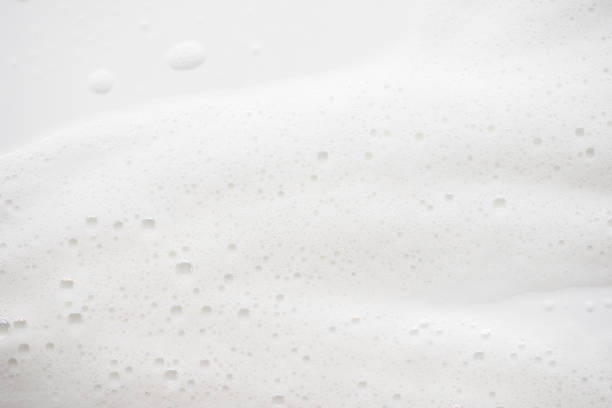 istock Abstract background white soapy foam texture. Shampoo foam with bubbles 1166208579