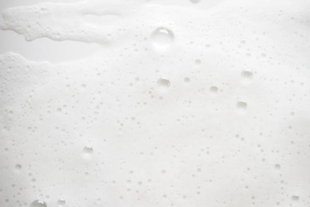 istock Abstract background white soapy foam texture. Shampoo foam with bubbles 1166208688