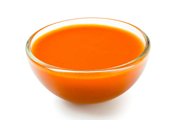 istock Peri peri chilli sauce in a glass bowl isolated on white. 1166209291