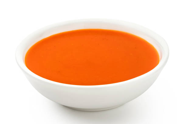 istock Peri peri chilli sauce in a white ceramic bowl isolated on white. 1166209295